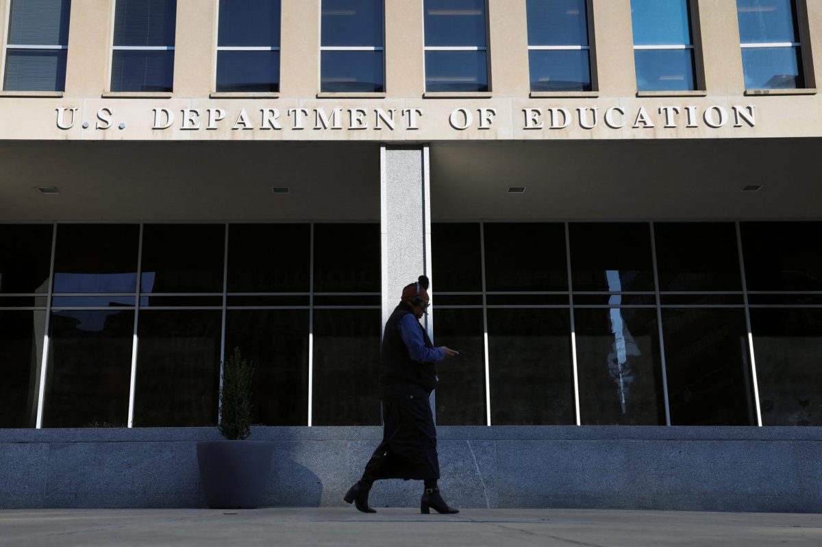 A person walks in front of the Department of Education building in Washington, D.C., as photographed on February 4, 2025. REUTERS/Kevin Lamarque